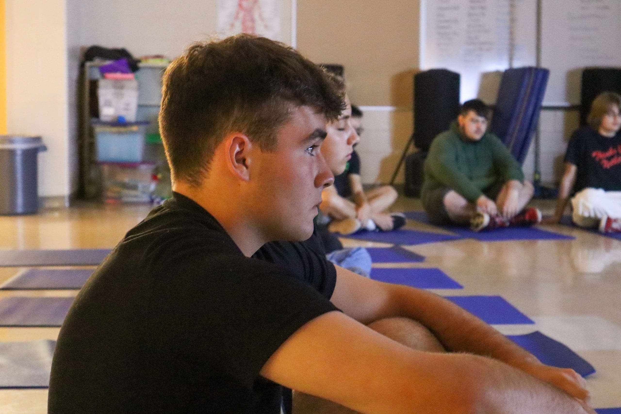 A student watches a PLT4M mindfulness lesson during physical education class.