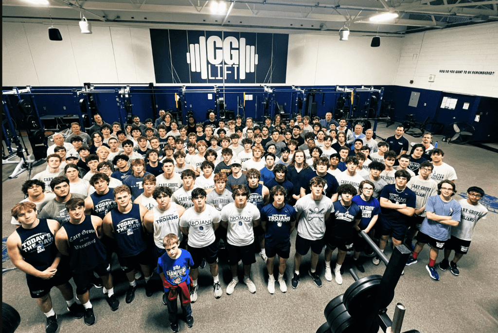 Group of Cary Grove students and athletes in the weight room.