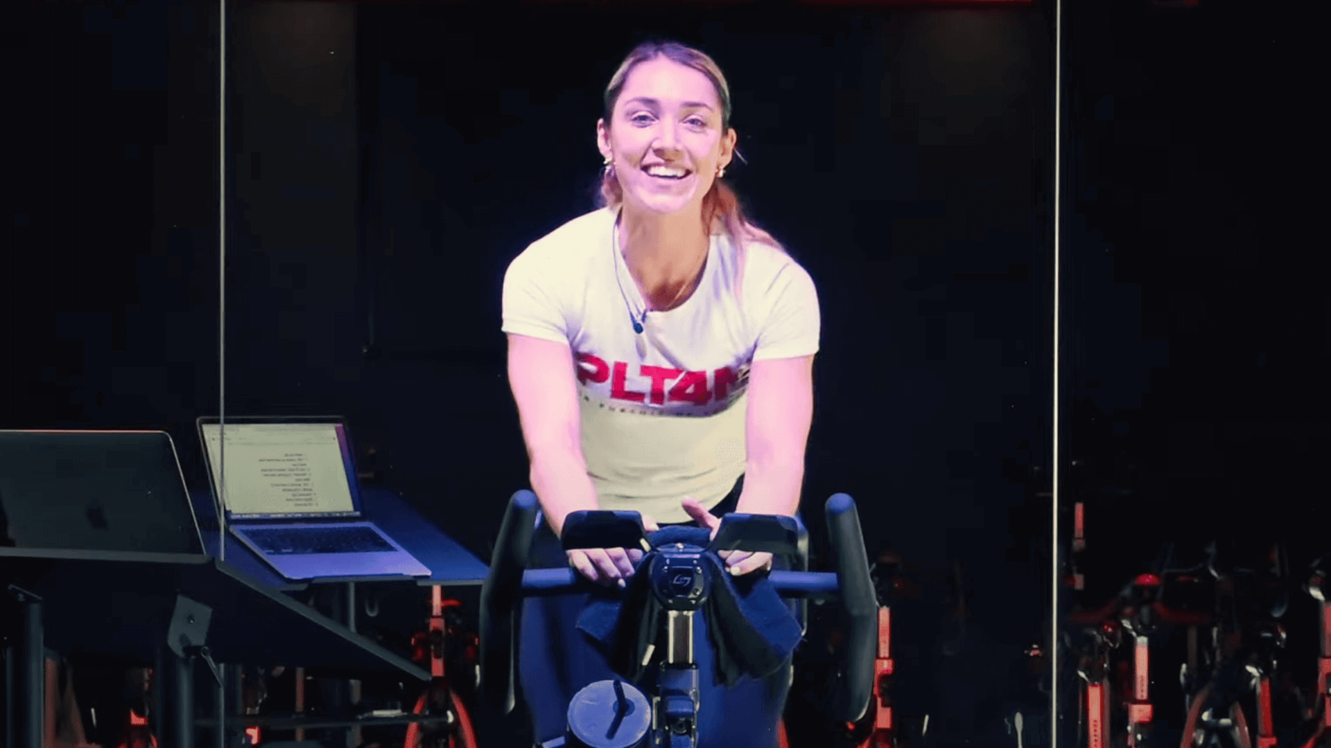 Spin bike workouts for beginners instructor Marguerite Lee on bike.