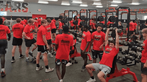 Athletes working out in the Le Mars weight room.