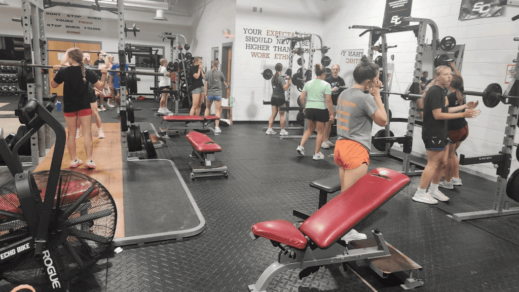 Girls workout inside the Sioux Central weight room.