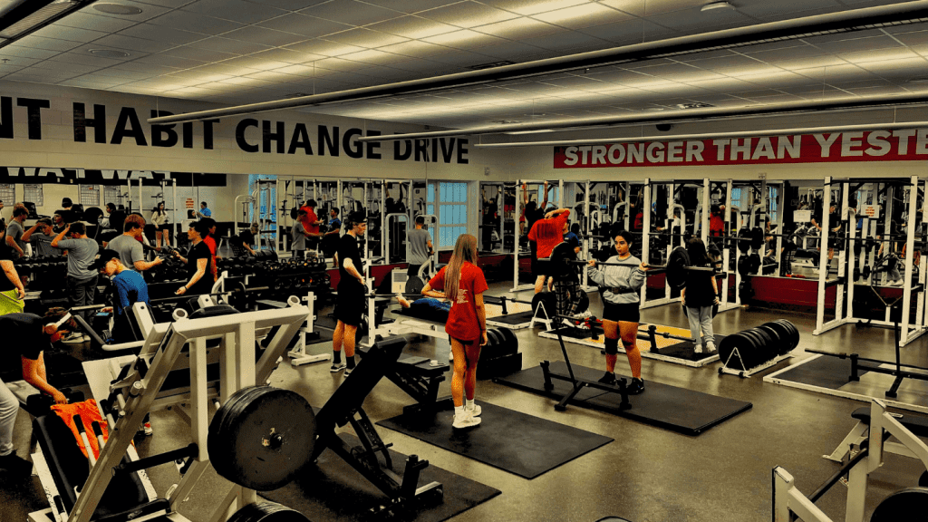 Students working out in the Paw Paw weight room.