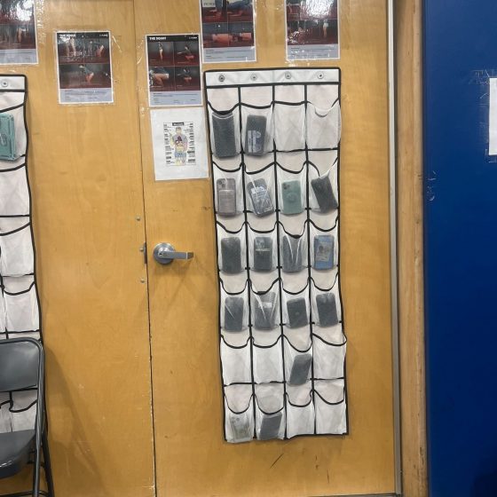 Phones stored in cubbies during physical education class.