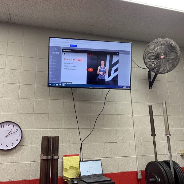 A PLT4M video displayed in the Jacksonville High School weight room.